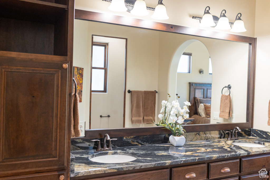 Bathroom with double vanity and ensuite bathroom