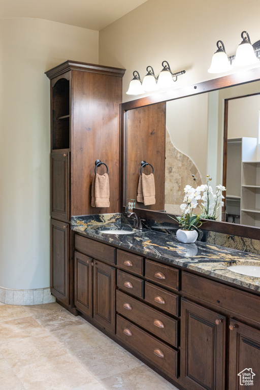 Full bath featuring double vanity