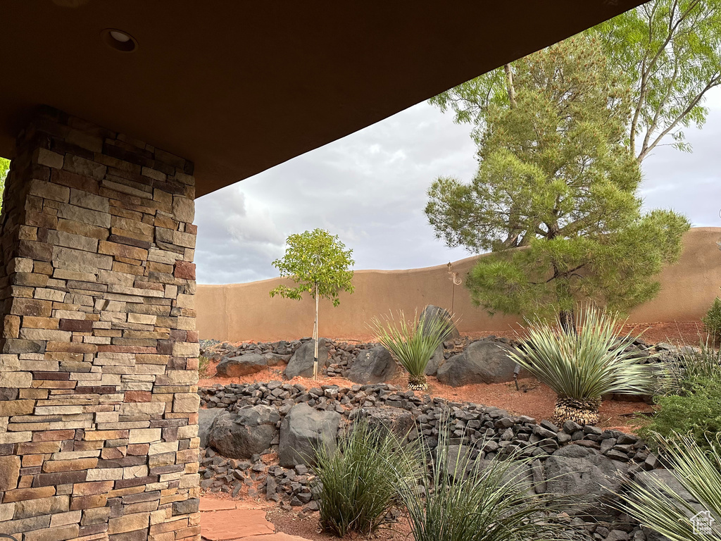 View of patio with fence