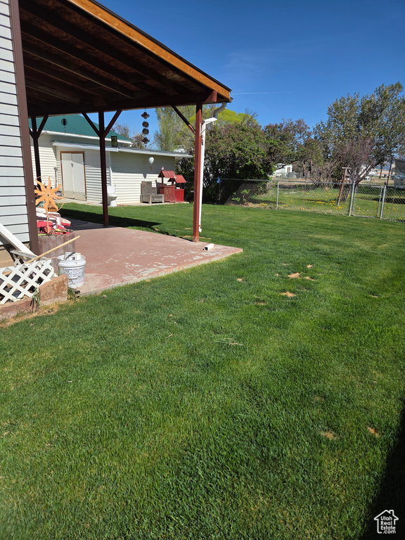 View of yard with a patio area