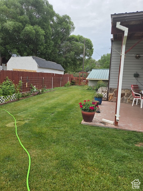 Fenced backyard featuring a patio area
