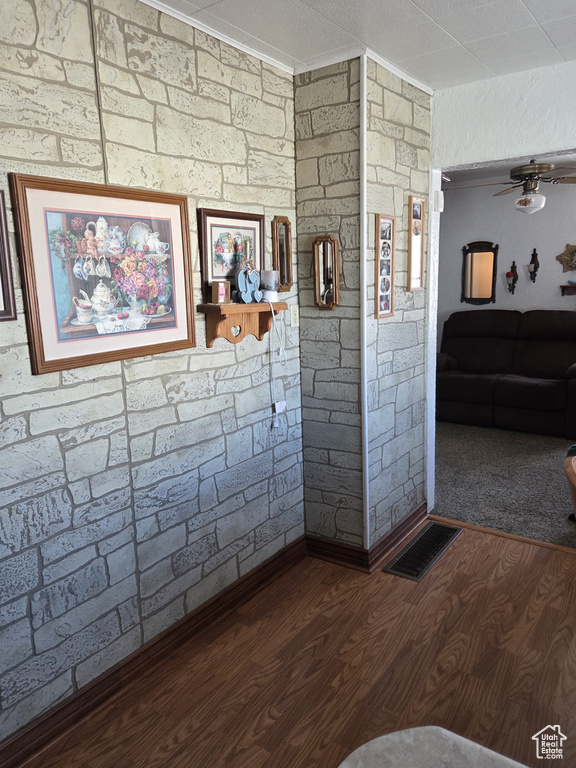 Bathroom featuring wood finished floors and ceiling fan