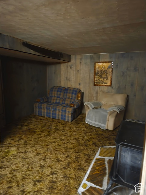 Sitting room featuring wood walls