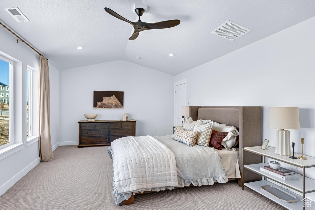 Carpeted bedroom featuring vaulted ceiling, baseboards, recessed lighting, and a ceiling fan