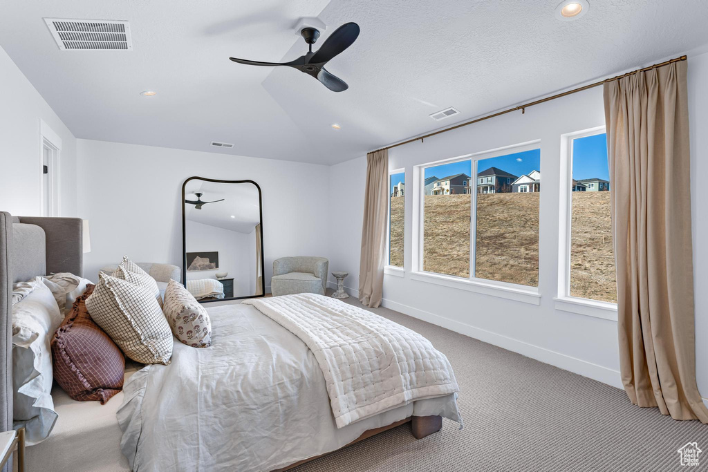 Bedroom featuring carpet floors, baseboards, ceiling fan, and recessed lighting