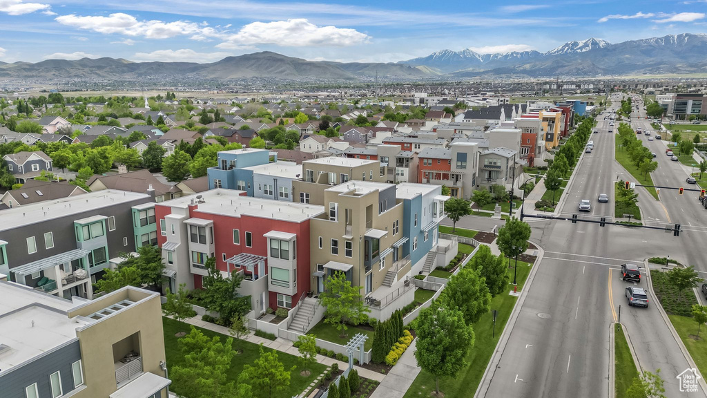 Aerial perspective of suburban area with a mountainous background