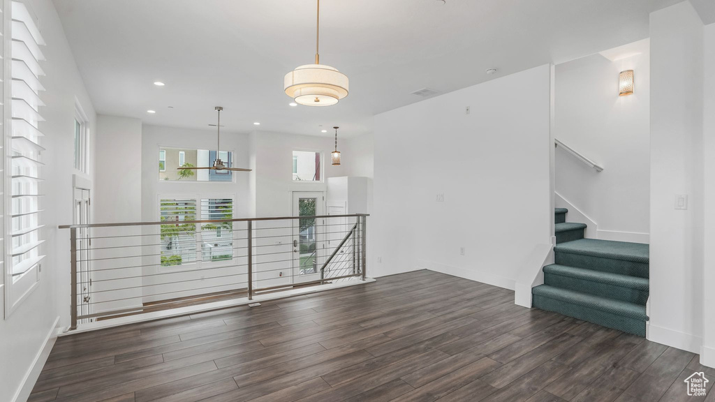 Unfurnished room with wood finished floors, recessed lighting, and baseboards