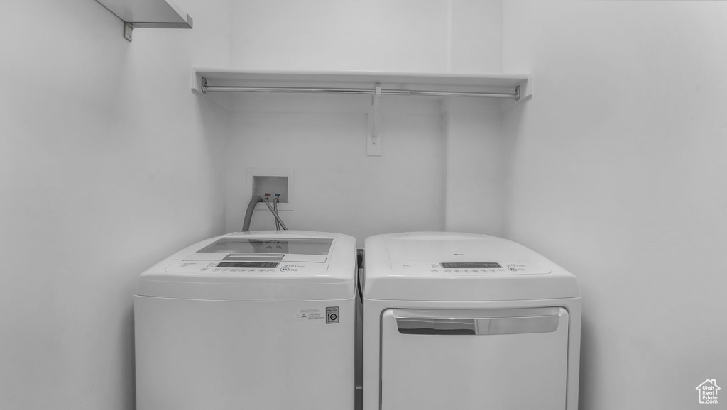 Laundry area with washing machine and clothes dryer