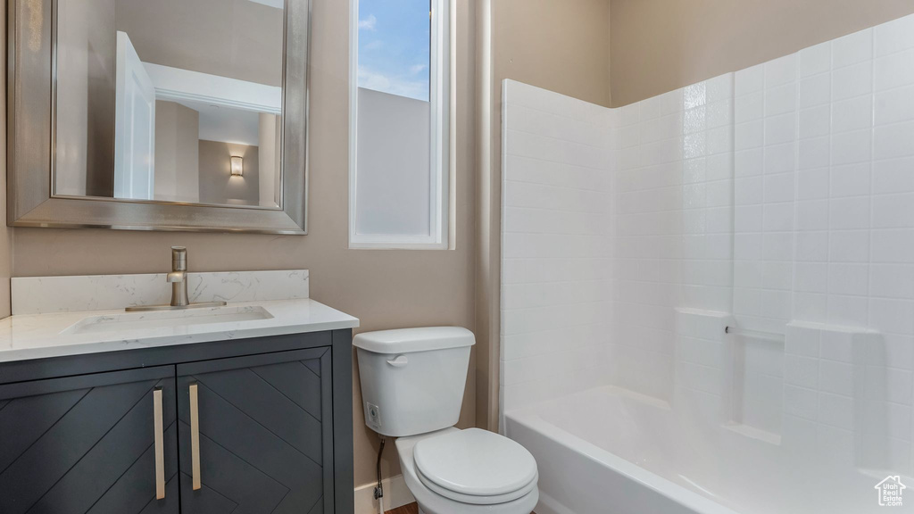 Full bath with toilet and vanity