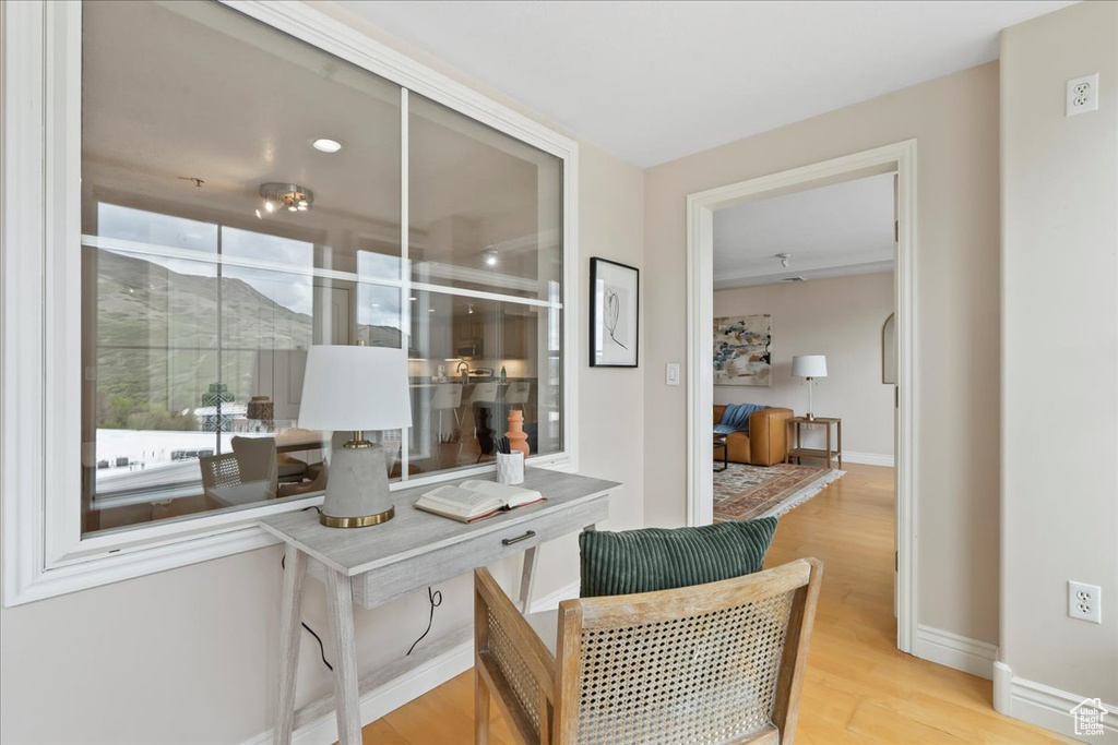 Corridor featuring wood finished floors and baseboards