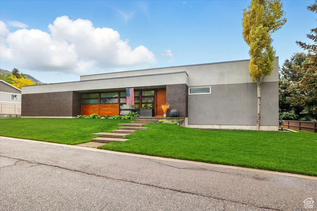 Contemporary house featuring stucco siding