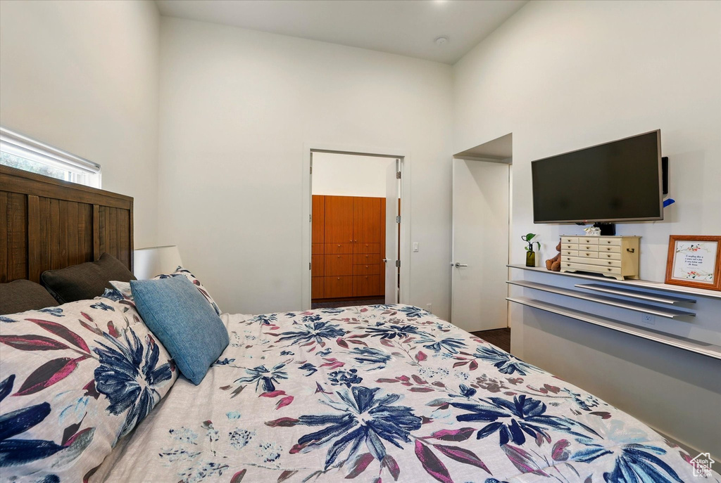 Bedroom featuring a high ceiling