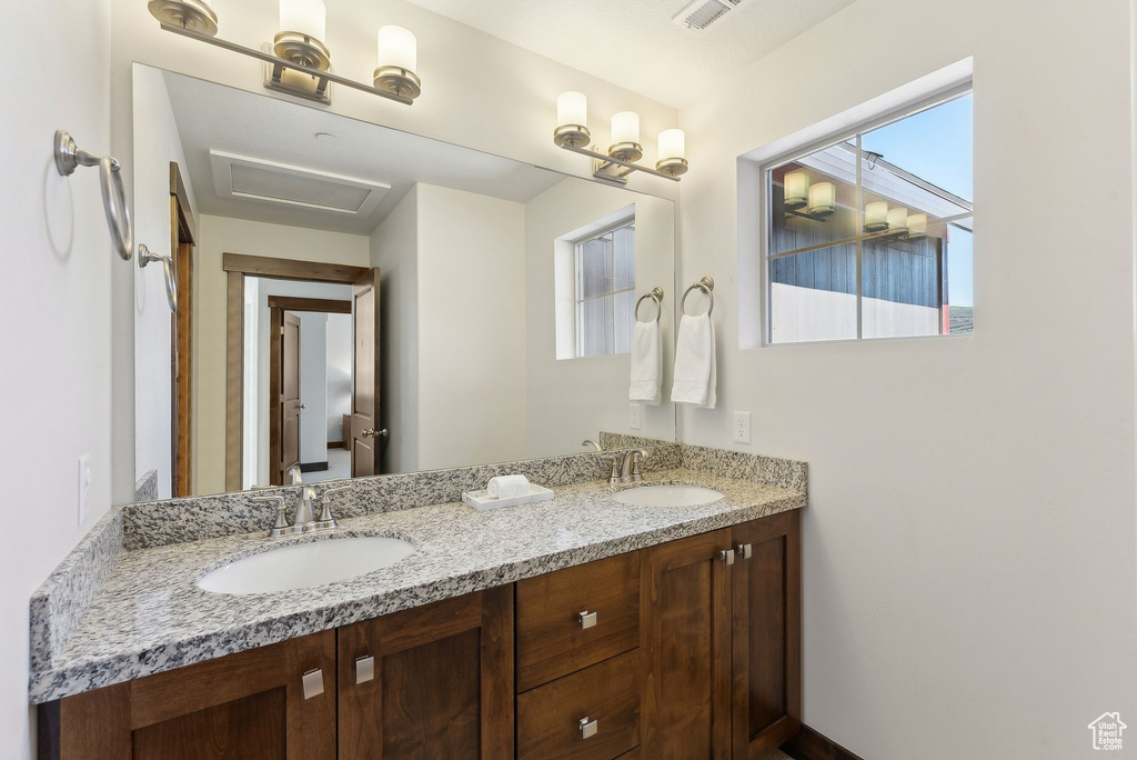 Bathroom featuring double vanity