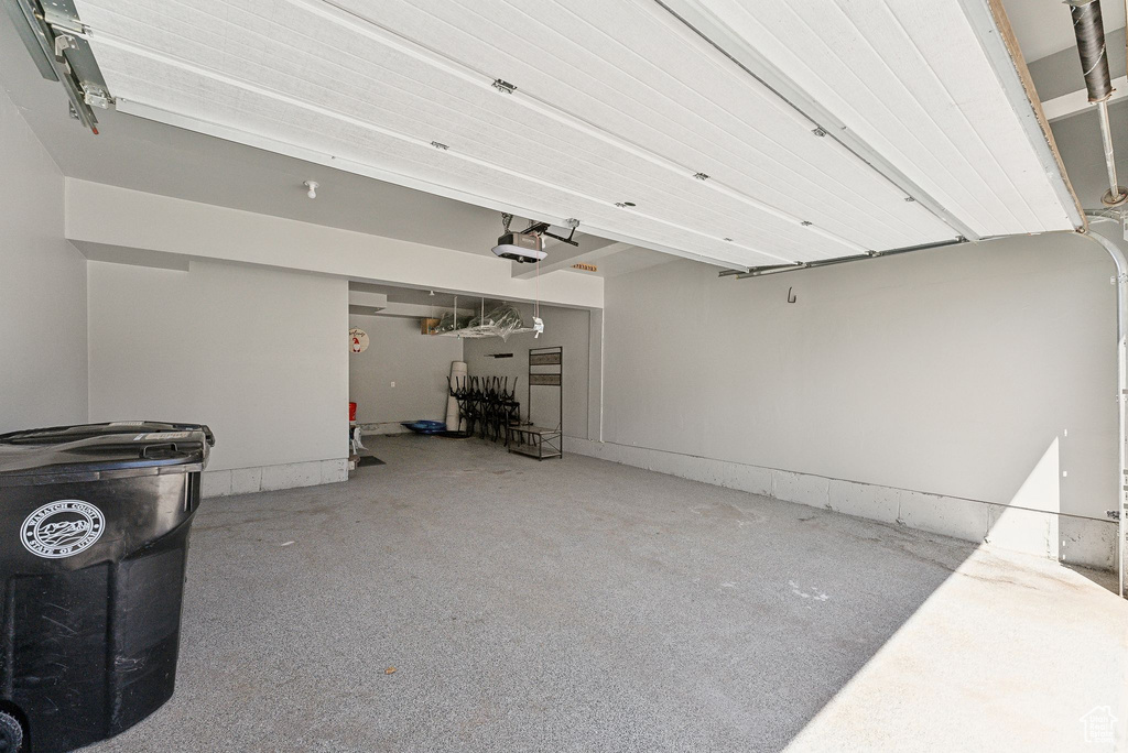 Garage featuring a garage door opener