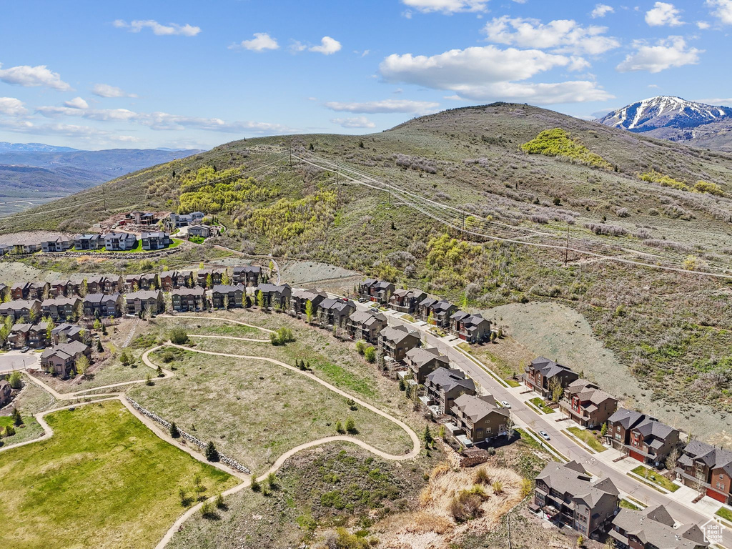 Aerial overview of property\'s location with nearby suburban area and mountains