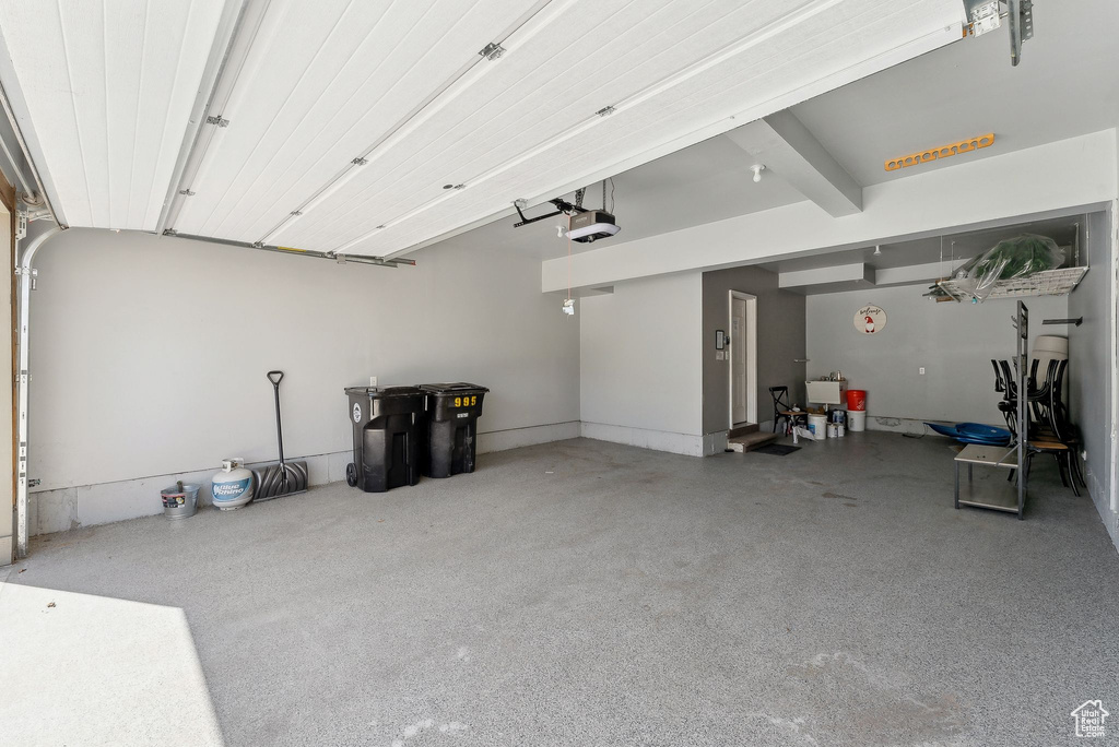 Garage featuring a garage door opener