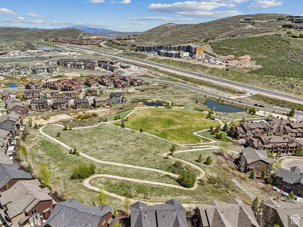 View of property location featuring nearby suburban area and a mountain backdrop