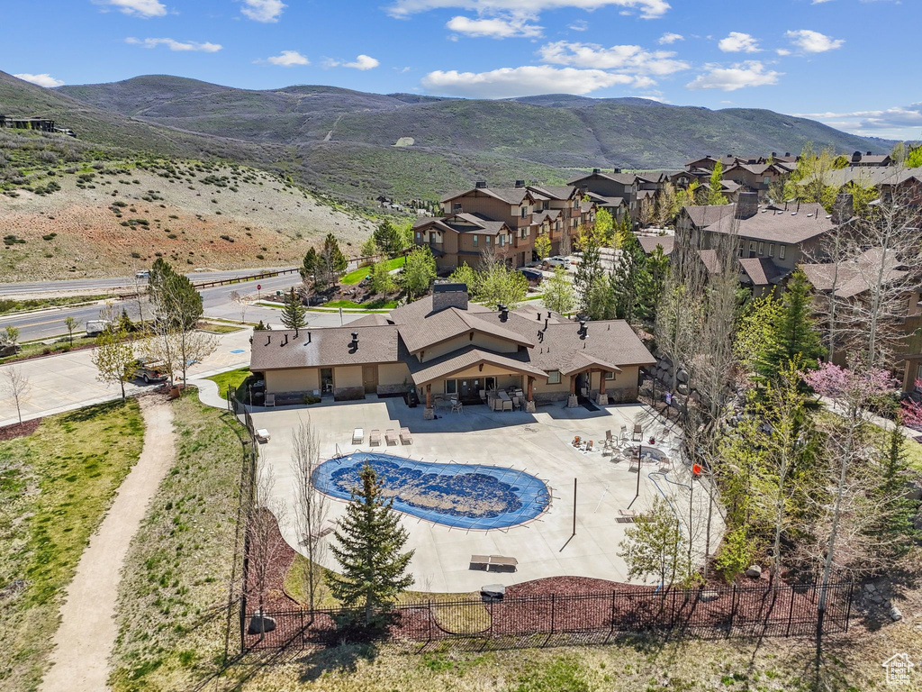 View of subject property featuring a mountainous background