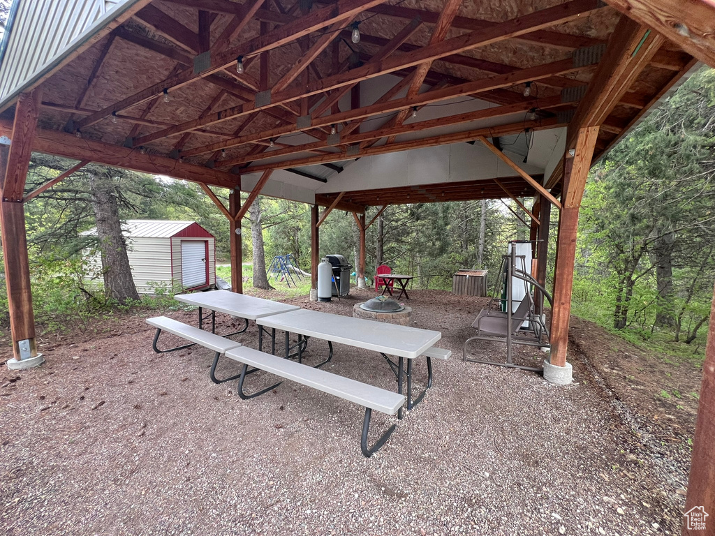 View of property\'s community with an outbuilding, a shed, and a patio