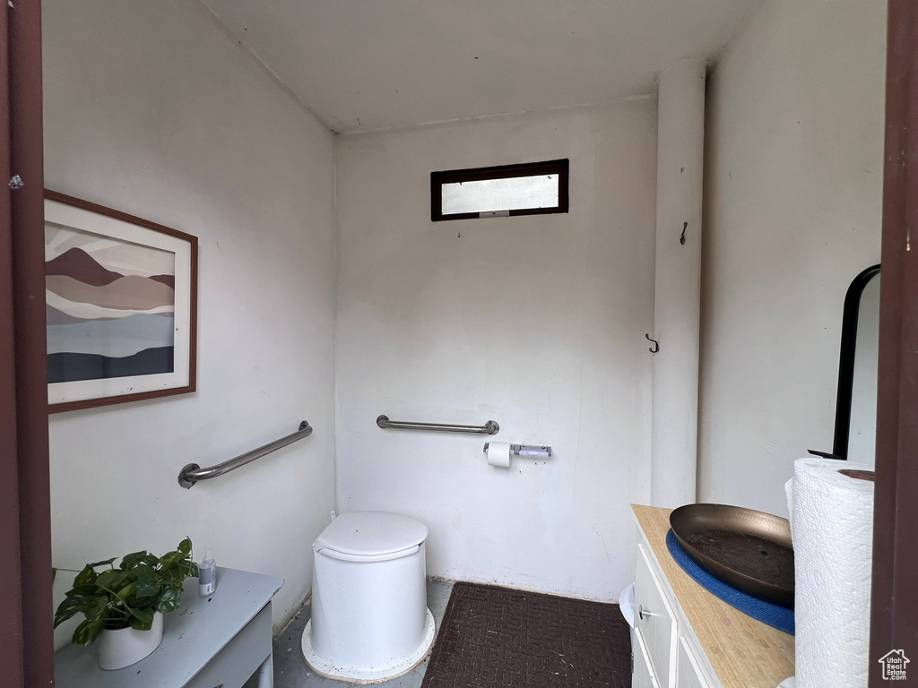 Half bath with vanity and toilet