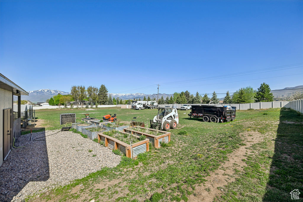 View of yard featuring a mountain view and a garden