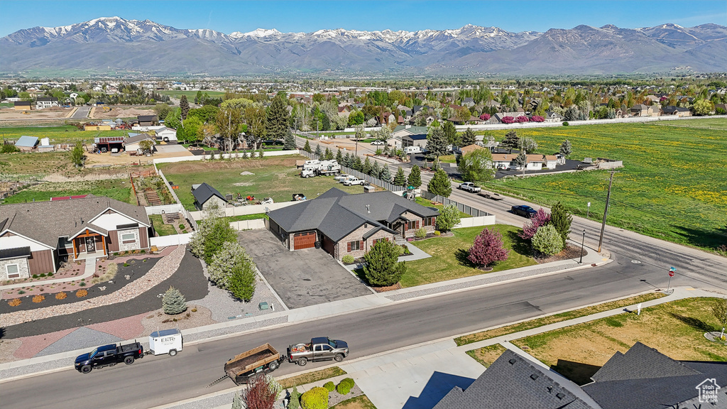 Aerial view of residential area featuring a mountain backdrop