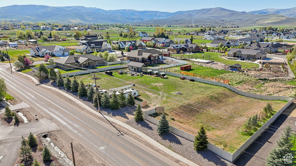 Aerial view of residential area featuring a mountainous background