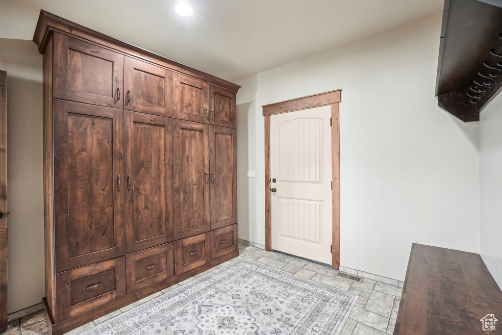 Mudroom featuring stone tile flooring