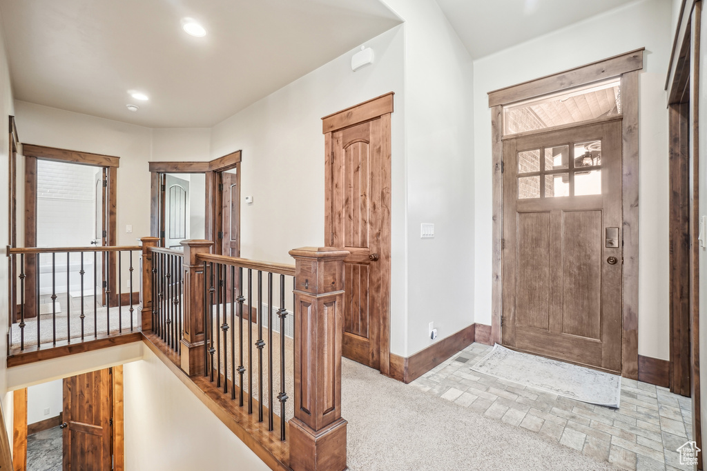 Entrance foyer featuring baseboards and recessed lighting