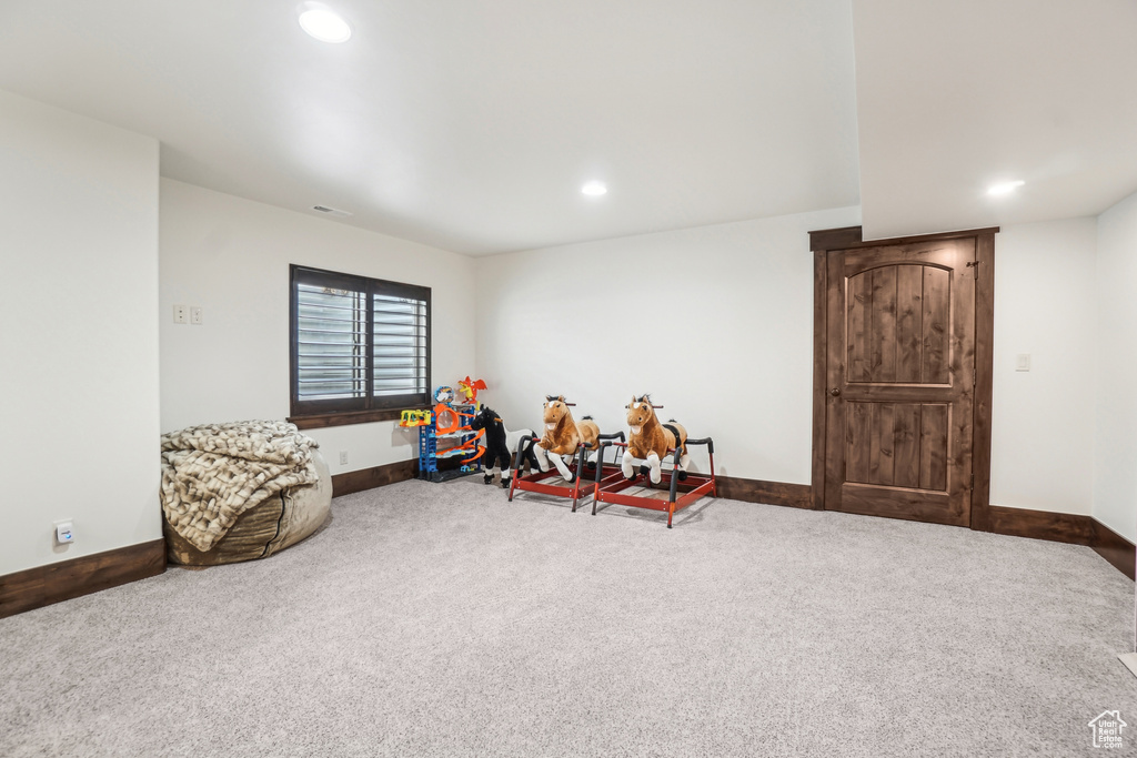 Rec room featuring carpet floors, baseboards, and recessed lighting