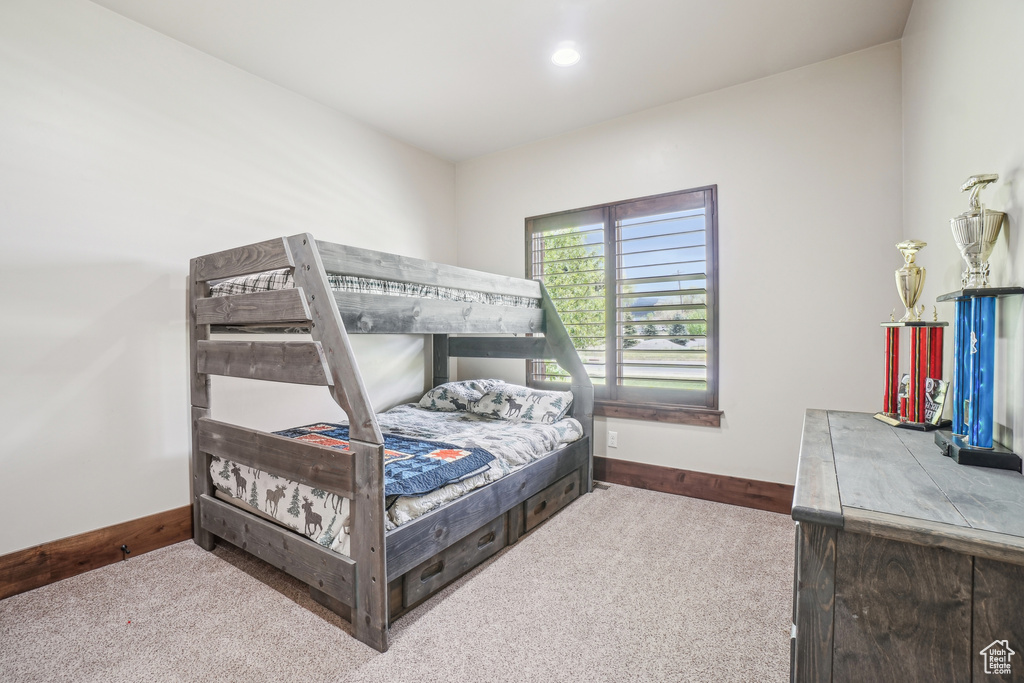 Bedroom with carpet flooring, baseboards, and recessed lighting