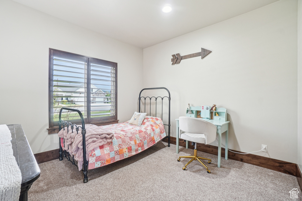 Carpeted bedroom with baseboards