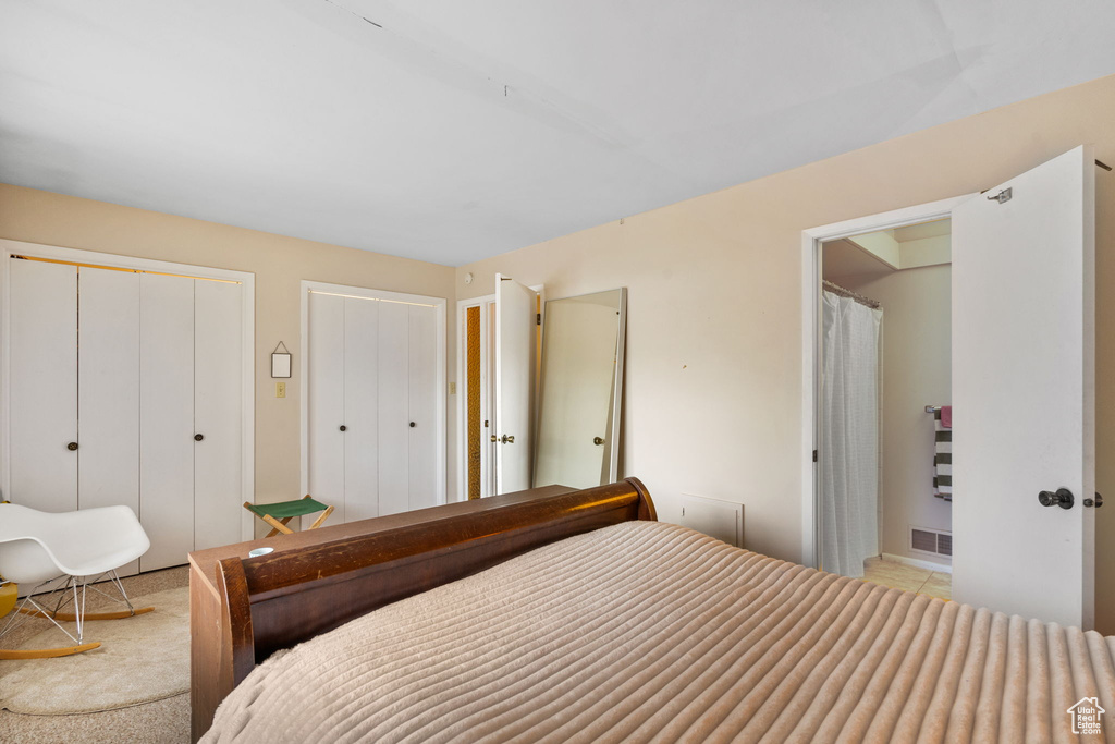 Bedroom featuring two closets