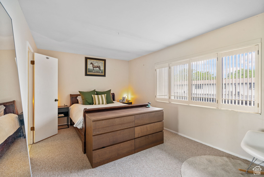 Carpeted bedroom with baseboards