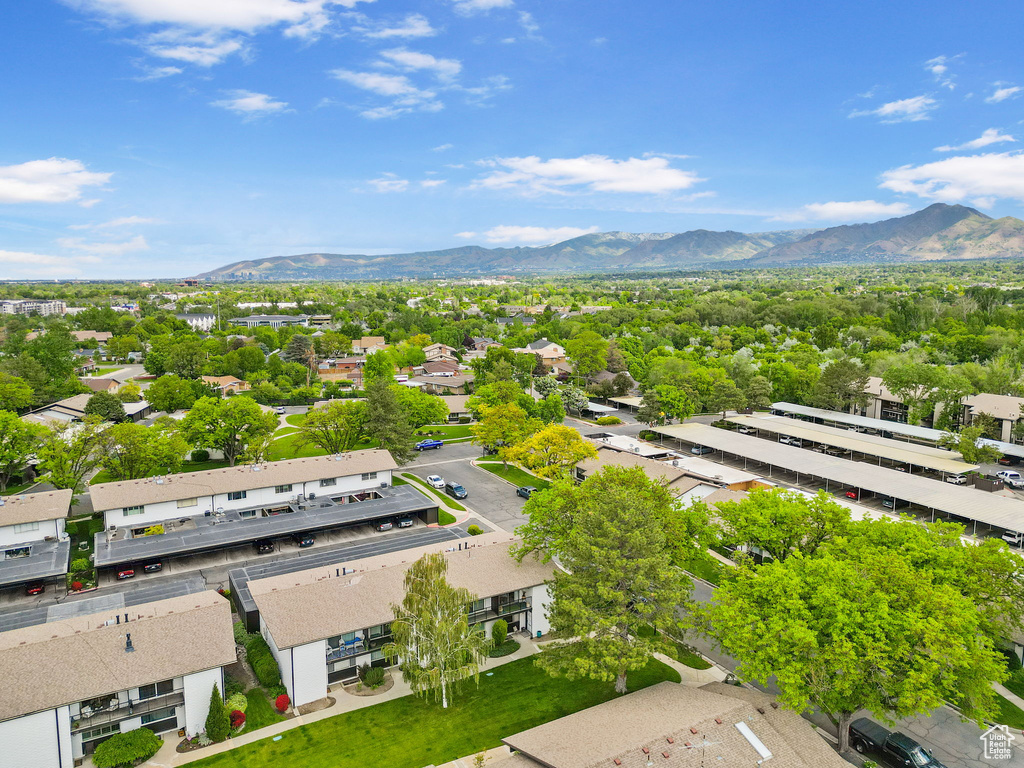 Aerial view of residential area featuring a mountain backdrop