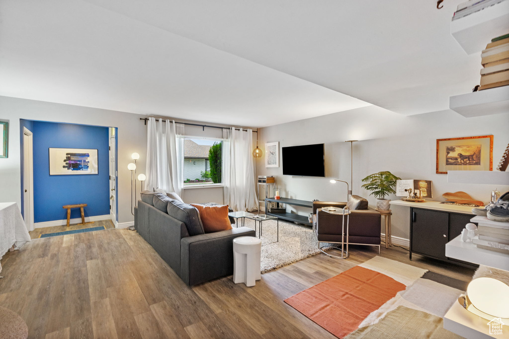 Living room with wood finished floors and baseboards