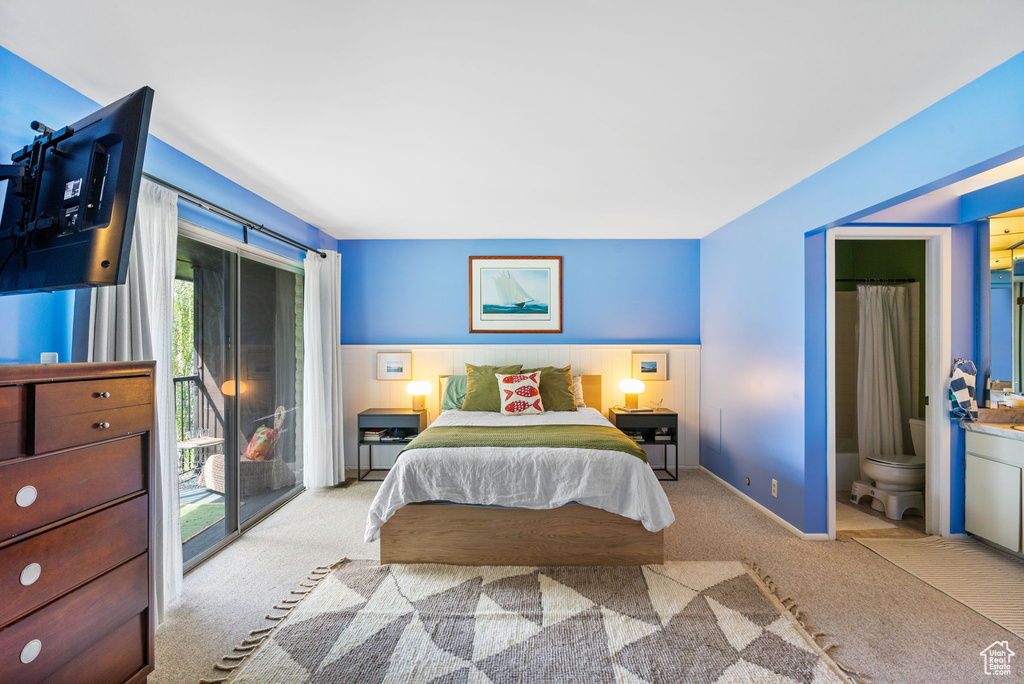 Carpeted bedroom with access to outside and connected bathroom