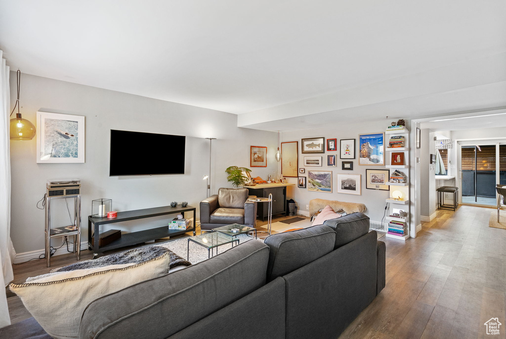 Living room with wood finished floors and baseboards