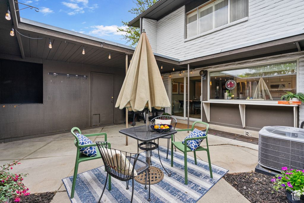 View of patio featuring central AC