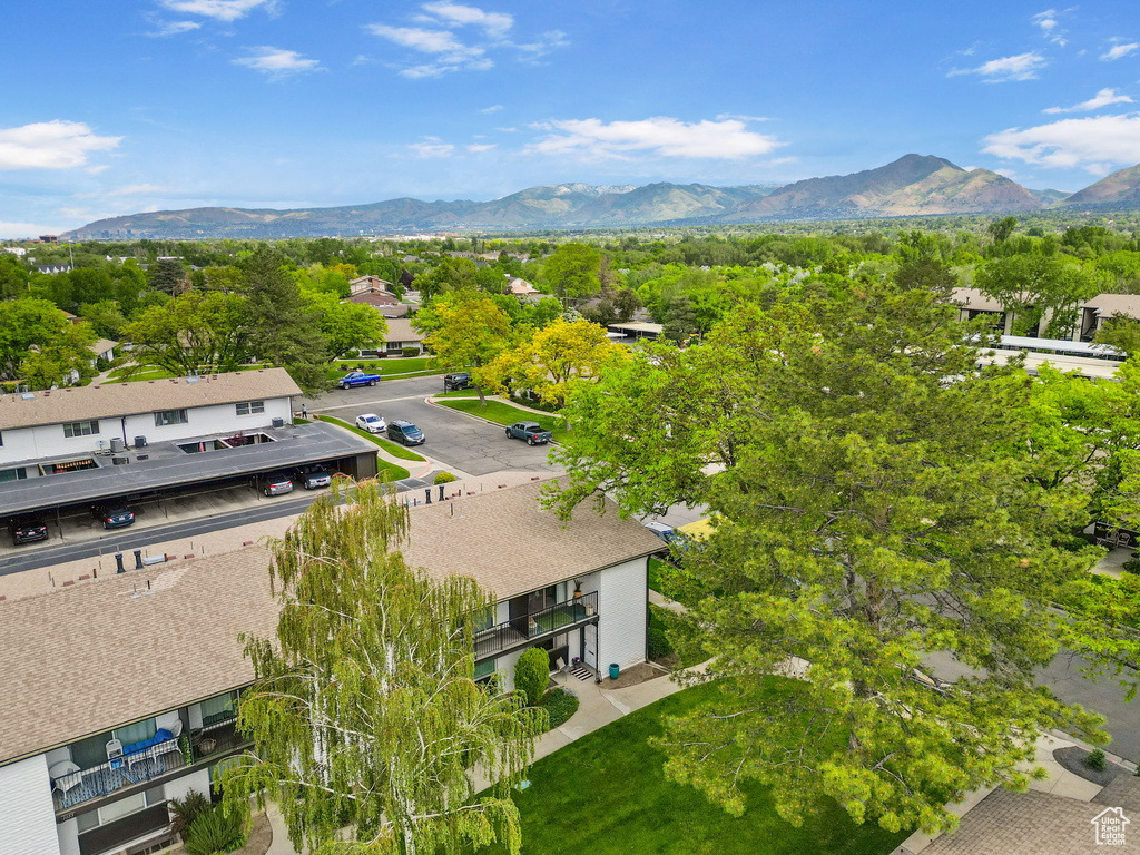 Aerial perspective of suburban area with a mountainous background