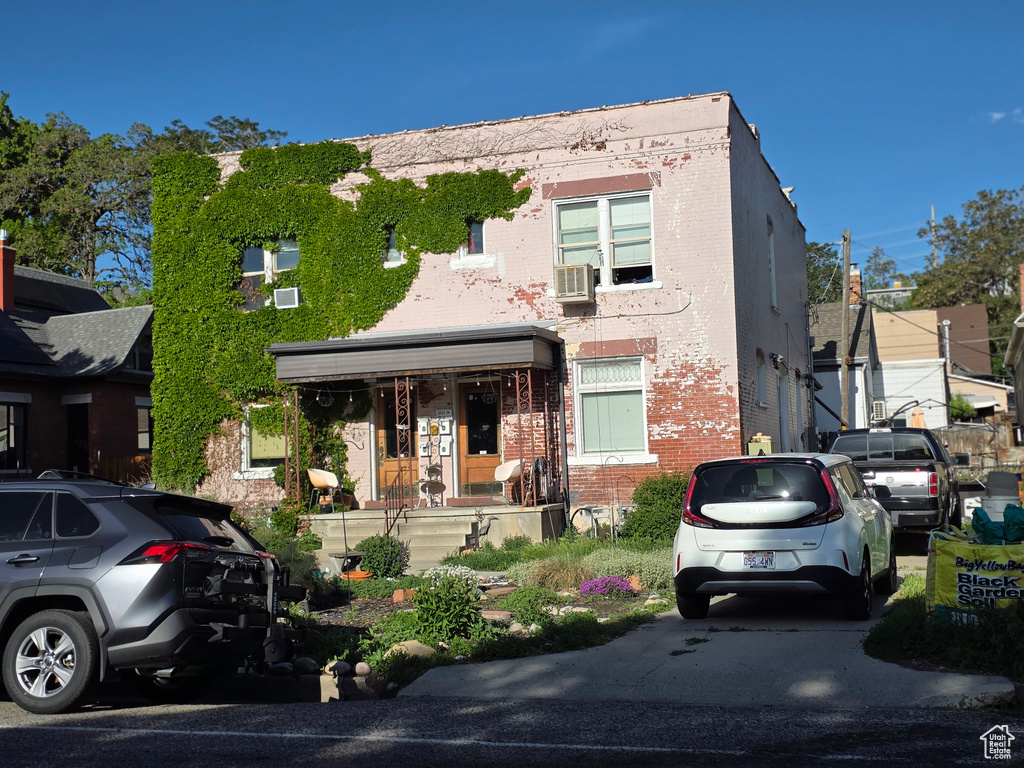 Multi unit property with brick siding and cooling unit