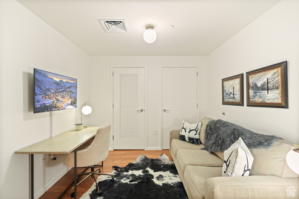 Home office with light wood-type flooring