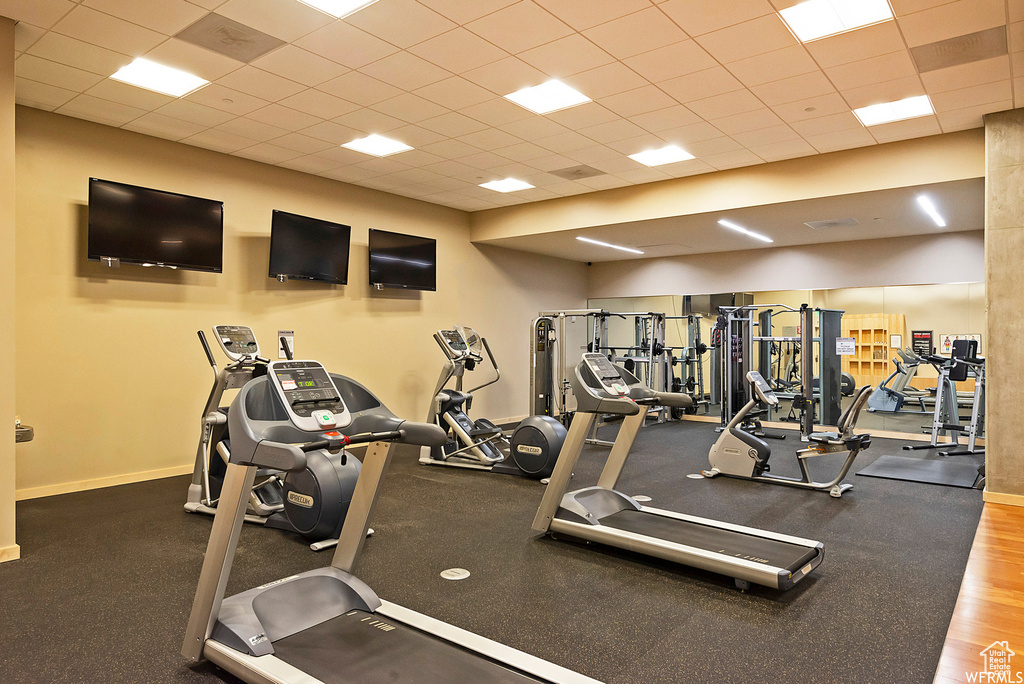 Workout area featuring baseboards