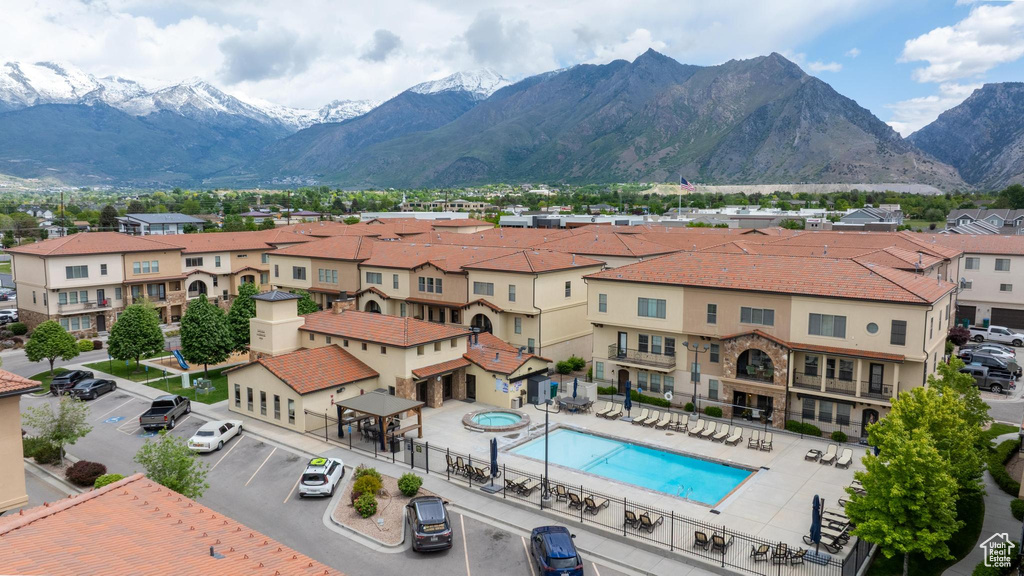 View of mountain backdrop featuring nearby suburban area