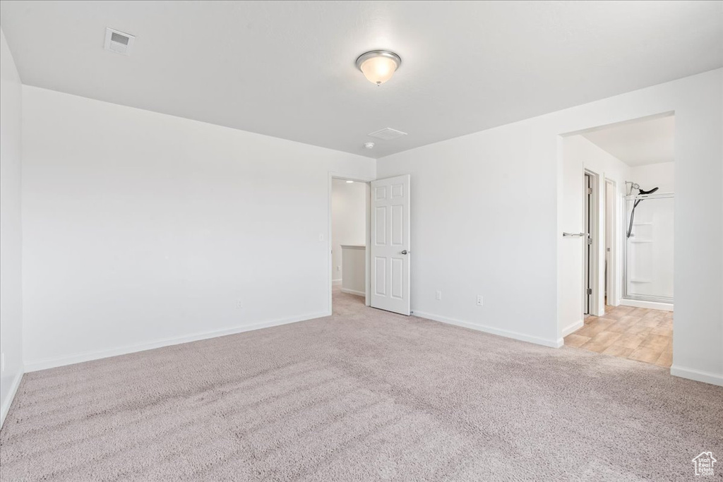 Unfurnished room with carpet flooring and baseboards