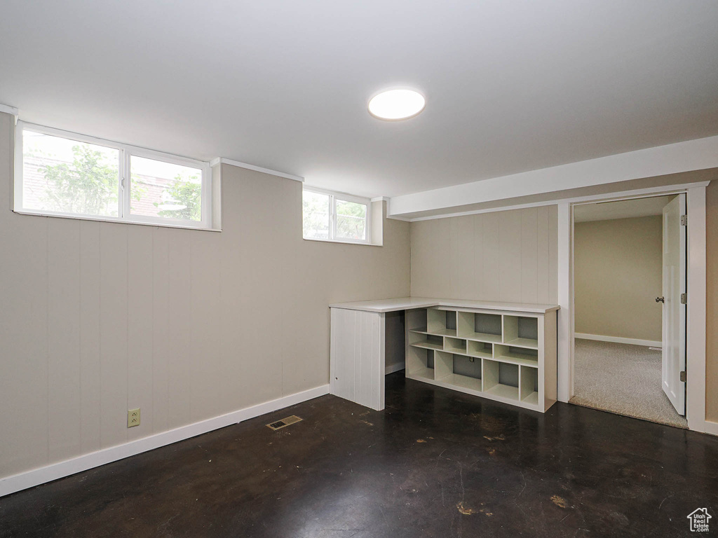 Basement featuring baseboards