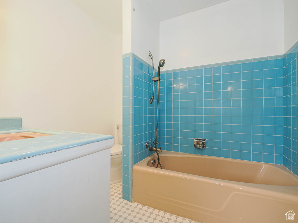 Bathroom with bathtub / shower combination and toilet