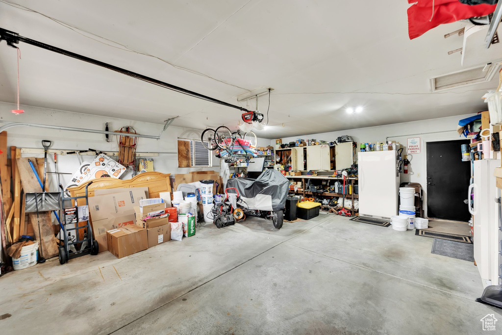Garage featuring a garage door opener