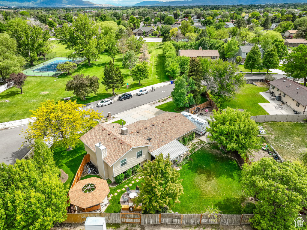 Aerial perspective of suburban area with a mountainous background
