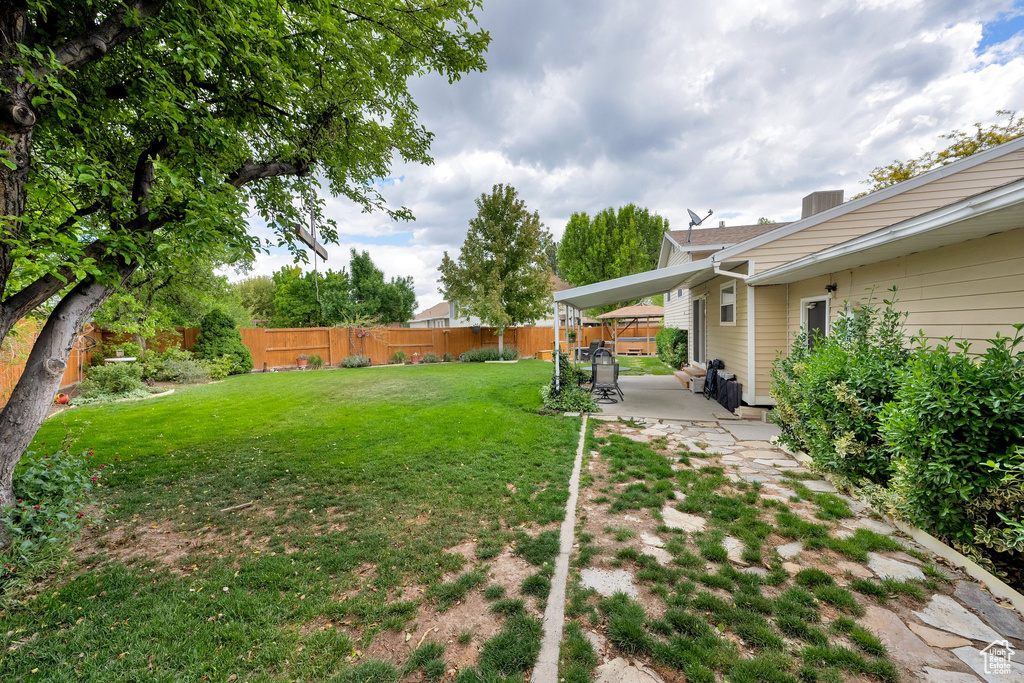 View of yard with a patio